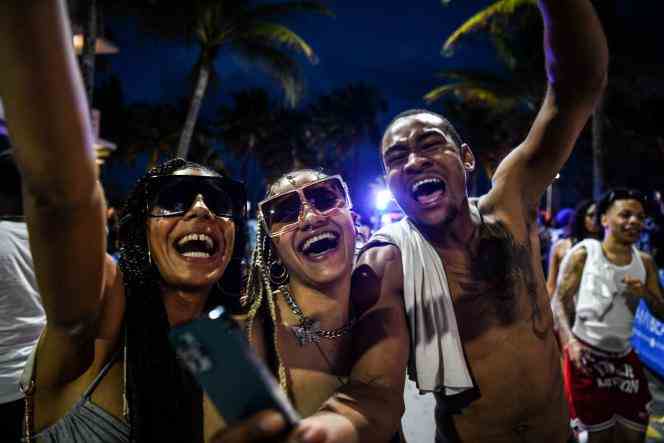 Partygoers dance on Ocean Drive in Miami Beach, Florida on March 18, 2022, during “Spring Break.”