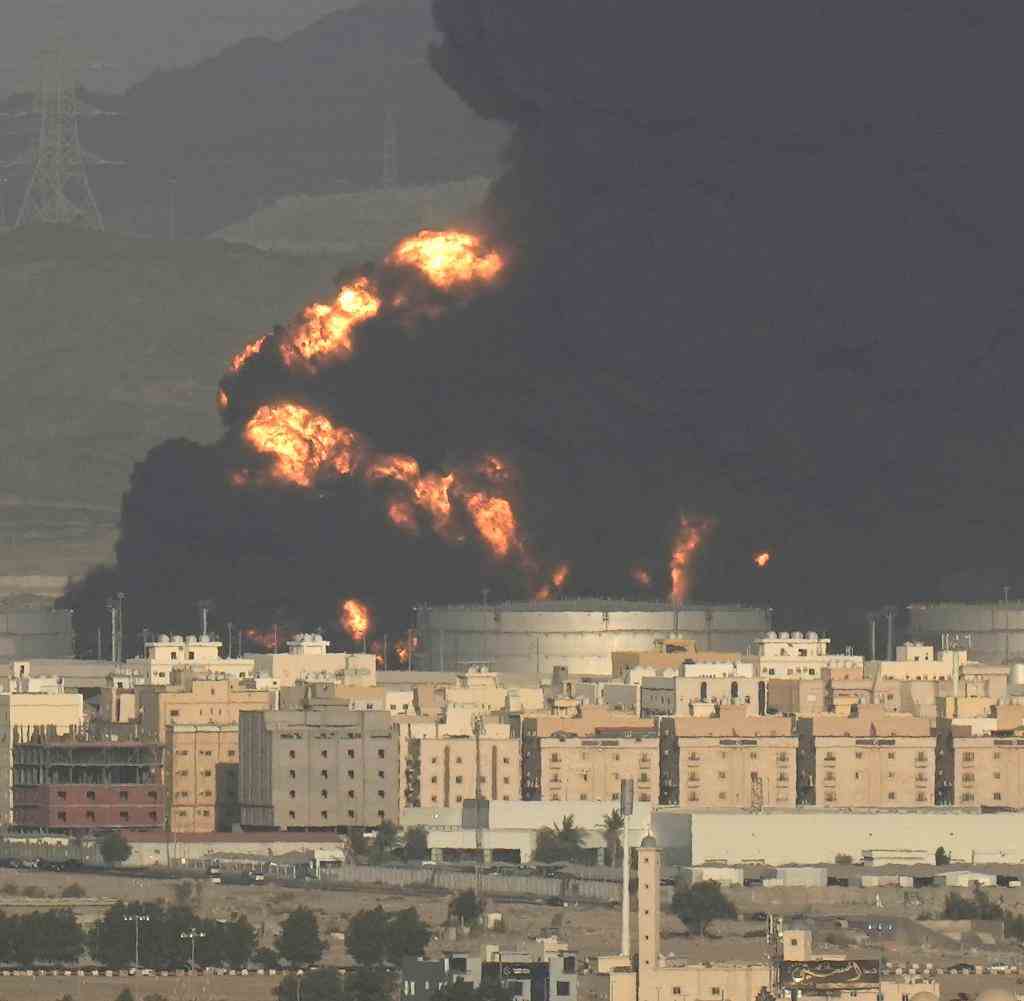 Fire and smoke billowed over Jeddah on Friday afternoon, the burning Aramco oil depot clouding the sky