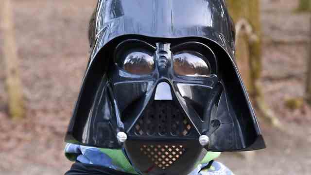 Green Forest: Darth Vader is standing in the forest.  Years ago, Christian Zimmermann's father wore the same costume on his birthday.