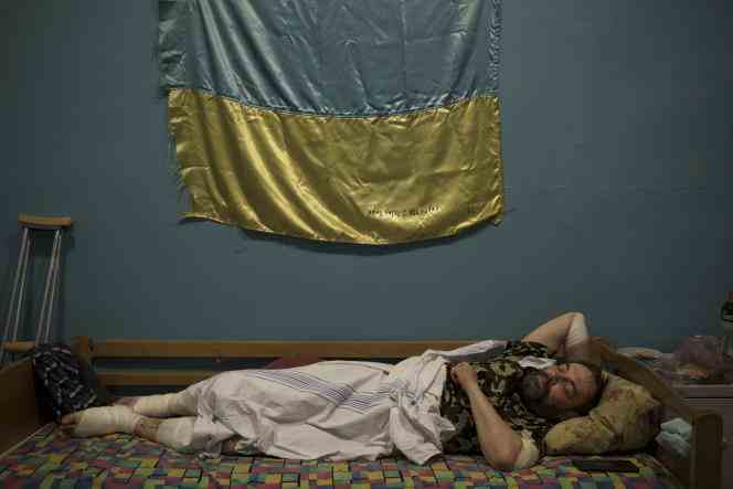 A Ukrainian commander rests after being injured in battle against Russian forces, at a military hospital in Zaporizhia, Ukraine, April 2, 2022. 