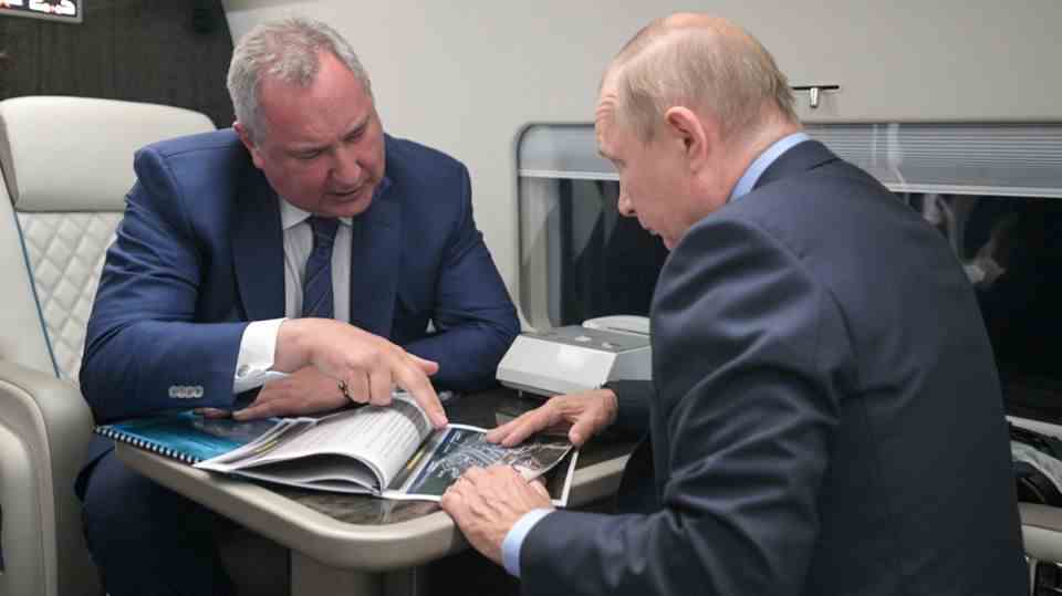 Dmitri Rogozin and Vladimir Putin in a private jet meeting.
