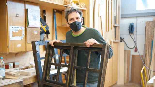Culture in Bavaria: workshop boss Peter Buchheit with a window for a stage set.  What makes it so special is that only the front side is worked out, the public doesn't see the other side.