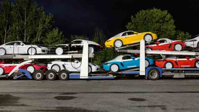Art and culture: A 81, Jagstal Ost: Colorful sports cars on a parked van.