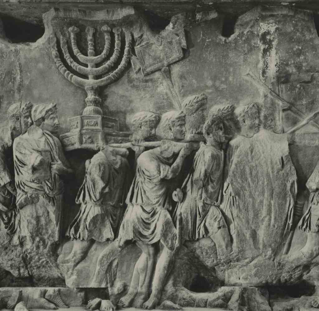 Rome (Italy), Arch of Titus (Triumphal Arch in the Roman Forum, erected 81 AD to honor the victory of Titus over the Jews, 70 AD).  Left inner relief: Triumphal procession with the seven-branched candlestick of Solomon's Temple in Jerusalem.  Photo.