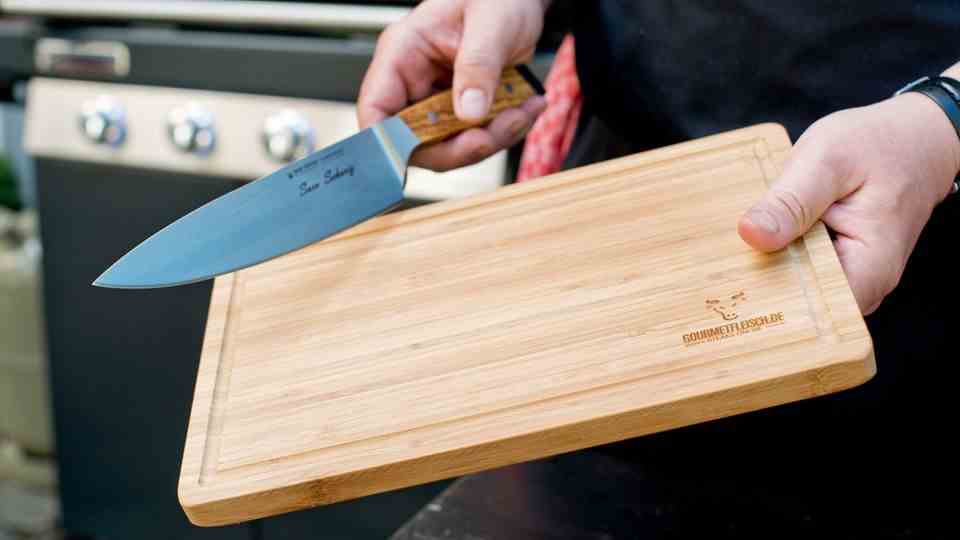 The be-all and end-all when grilling: Make sure you use a sharp knife and cut on wood so that the knife does not become blunt.  In addition, you should never push anything off the board with the blade of the knife, which is exactly why a knife has two sides.