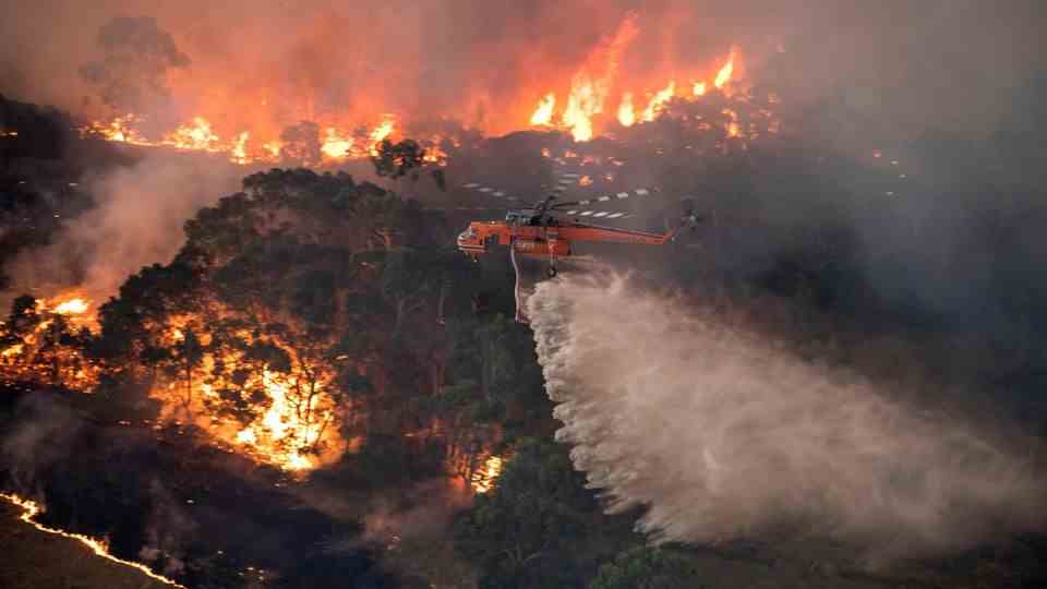A helicopter over the sea of ​​flames