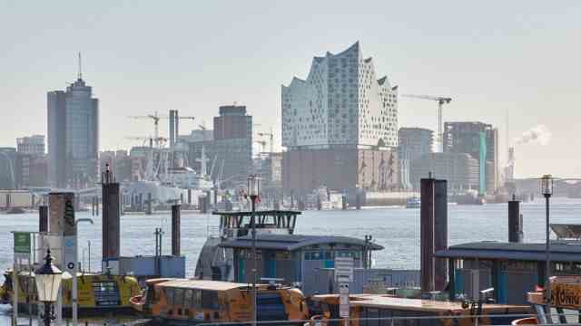 Port of Hamburg: View of the Elbphilharmonie and a ferry terminal - culture, tourism and trade are close together in the Port of Hamburg.