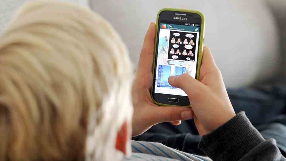 Child uses smartphone