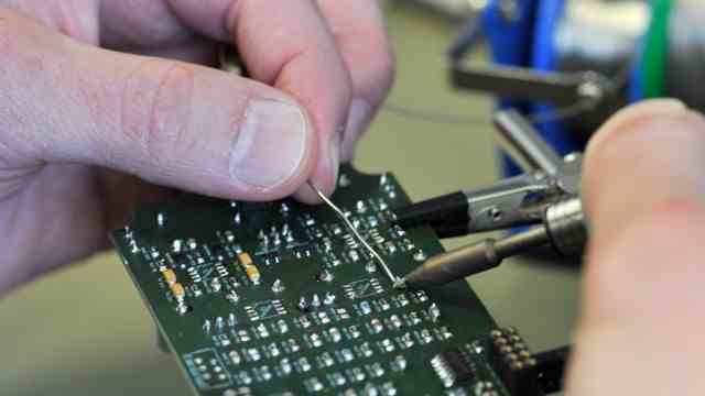 Guitar effects: Soldering work: Marc Widmaier is working on one of his circuit boards.