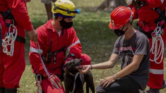 Cuba: Dogs searched the rubble for more victims on Sunday.
