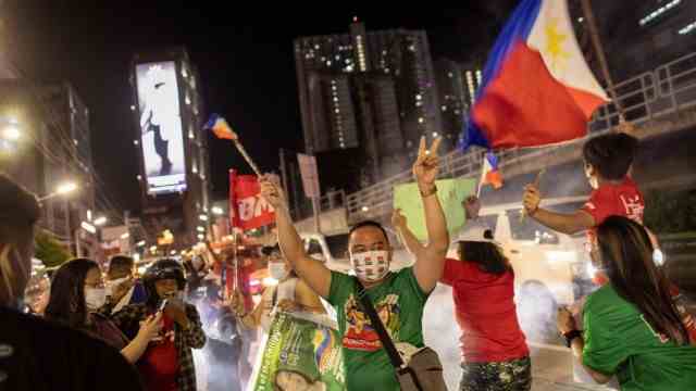 Duterte successor: In celebration: Marcos Jr. supporters celebrate when the first partial results are announced.