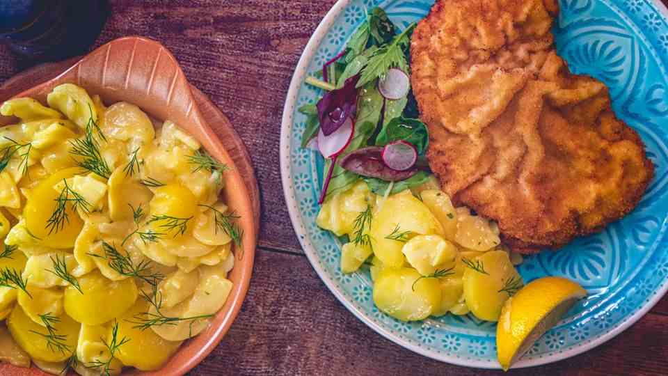 Austria: Wiener Schnitzel It is the national dish of Austria and only authentic if it is made with veal.  It goes well with potato salad.  Here's the recipe!