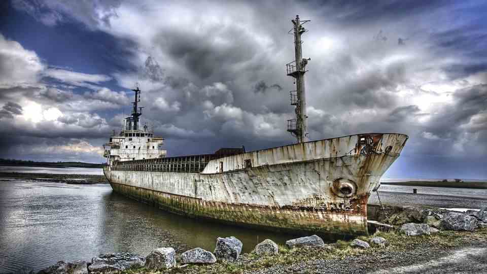 Image 1 of 11 of the photo gallery to click: Ireland on the River Shannon This coaster is rusting away on the banks of the Shannon.  One of many motifs from the new illustrated book "wrecks"which was published by Geramond.