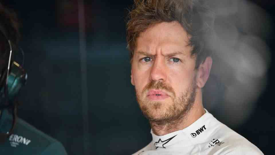 Aston Martin driver Sebastian Vettel frowns and looks concerned