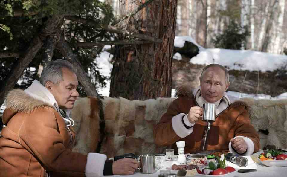 Vladimir Putin shares tea with Defense Minister Sergei Shoigu in the Siberian taiga in March 2021 