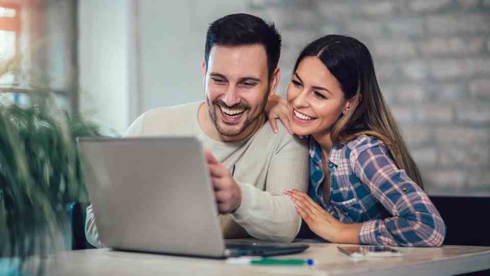 Woman and man shopping online on Amazon Prime Day 2022
