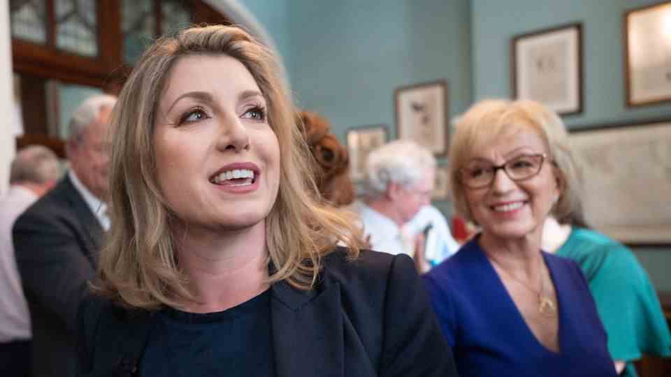 Penny Mordaunt (L) smiles as she unveils her campaign for her bid for the Conservative Party leadership