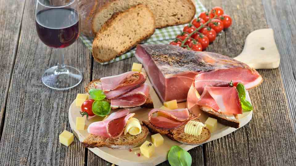 South Tyrolean red wine with cheese, ham and fresh bread