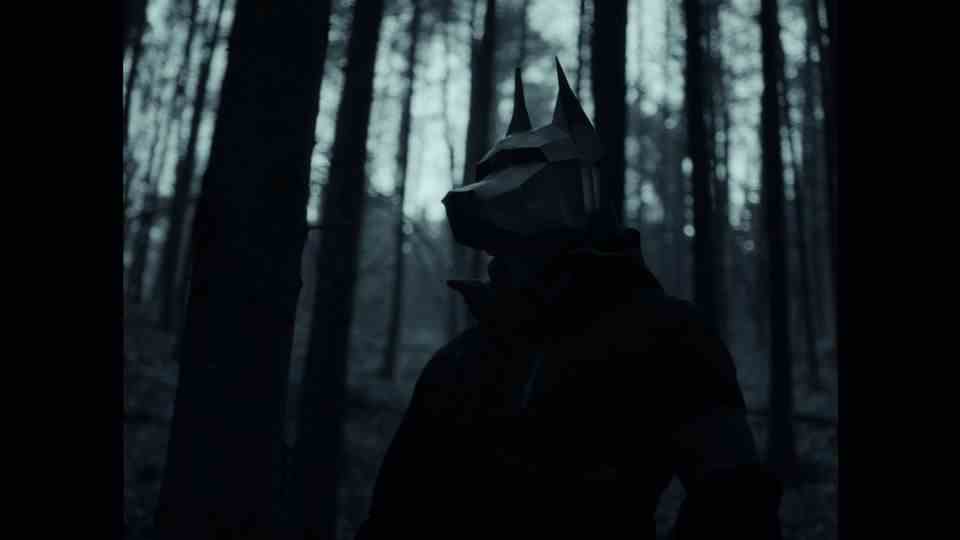 A musician with an animal mask in the forest