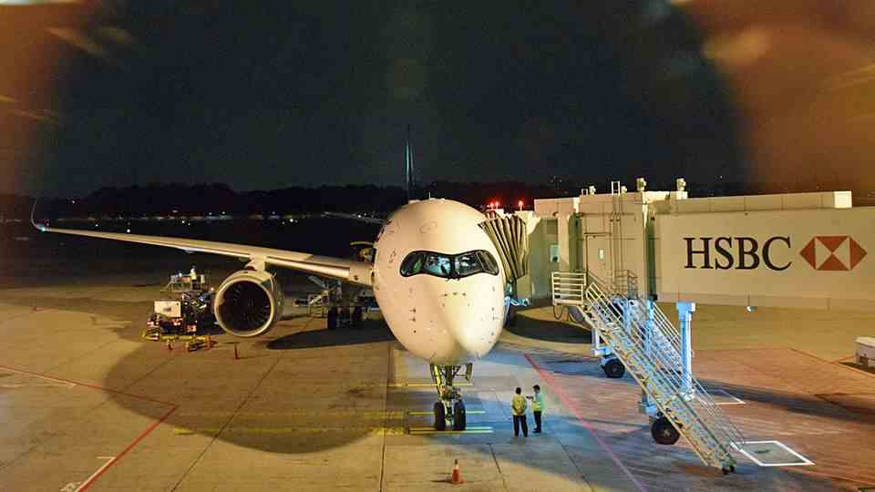 At Changi Airport in Singapore: The Airbus A350-900 ULR is parked at the gate.  The abbreviation ULR stands for "Ultra long range".
