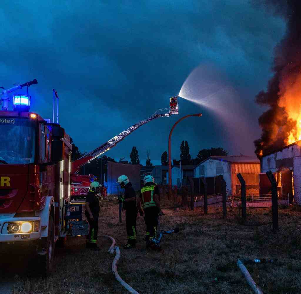 Firefighters try to extinguish a burning building in Kölsa
