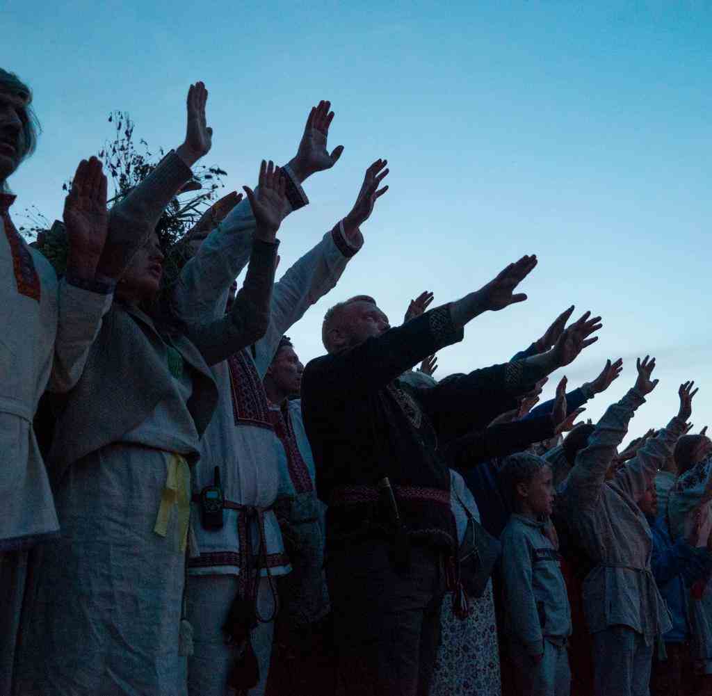 People take part in an ancient pagan ceremony celebrating the summer solstice near the village of Glubokovo, some 80 kilometres east of Moscow on June 24, 2017. In the tiny village of Glubokovo, some 80 kilometres east of Moscow, several hundred people gathered to mark an ancient pagan ceremony to celebrate the summer solstice. Women sang in circles as men collected firewood for a gigantic bonfire that formed a blazing centrepiece for the festivities. The pagan ritual is believed to be one of the oldest in the world and marks the shortest night of the year. / AFP PHOTO / Andrei BORODULIN (Photo credit should read ANDREI BORODULIN/AFP via Getty Images)