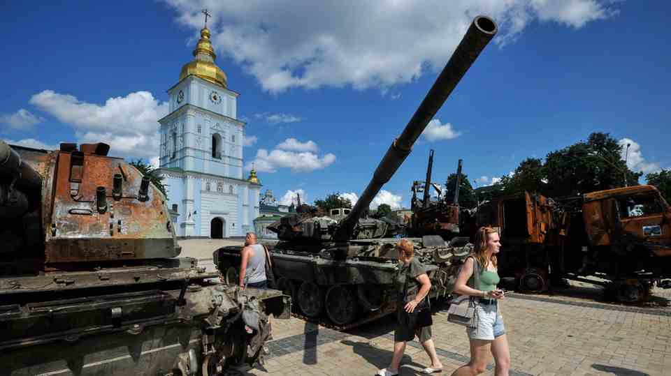 People look at destroyed captured Russian military equipment in Kyiv