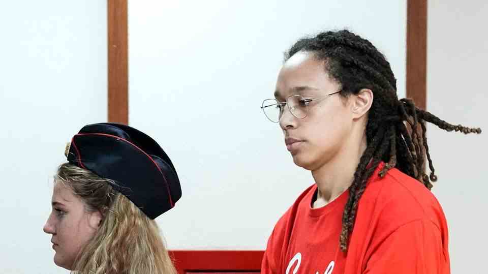 Brittney Griner (right), WNBA star and two-time Olympic gold medalist, is led to a hearing in a courtroom in Khimki, just outside Moscow