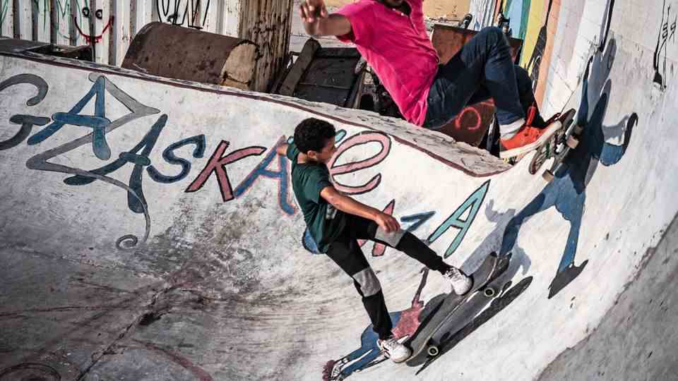 Two boys skate in the halfpipe at the port of Gaza City