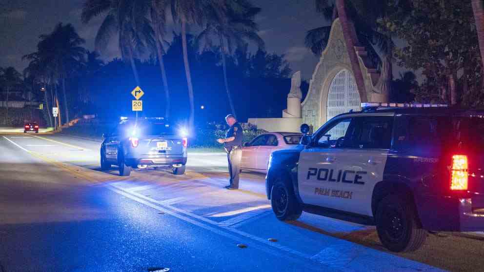 A Palm Beach County Police officer stands outside Donald Trump's Mar-a-Lago, Florida, home that has been searched by the FBI