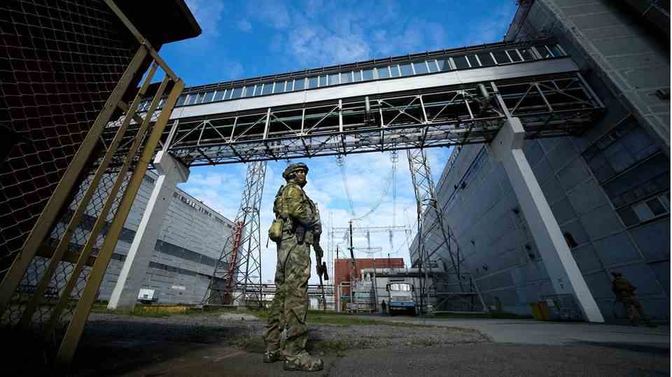 In this photo, taken during a trip organized by the Russian Defense Ministry, a Russian soldier guards an area of ​​the Zaporizhia nuclear power plant in an area under Russian military control in south-eastern Ukraine. 