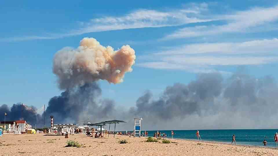 Saky, Ukraine.  Smoke rises from an explosion on the beach.