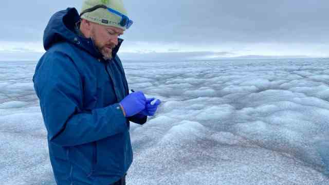 Climate change: Jason Box takes ice samples during the melting season in West Greenland.