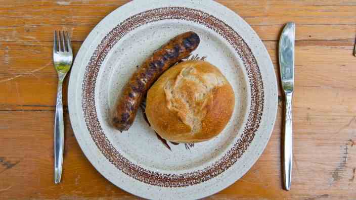 In the middle of Ebersberg: A bratwurst with a roll is a delicious meal.  However, if you try to eat both in one hap, you will run into problems.