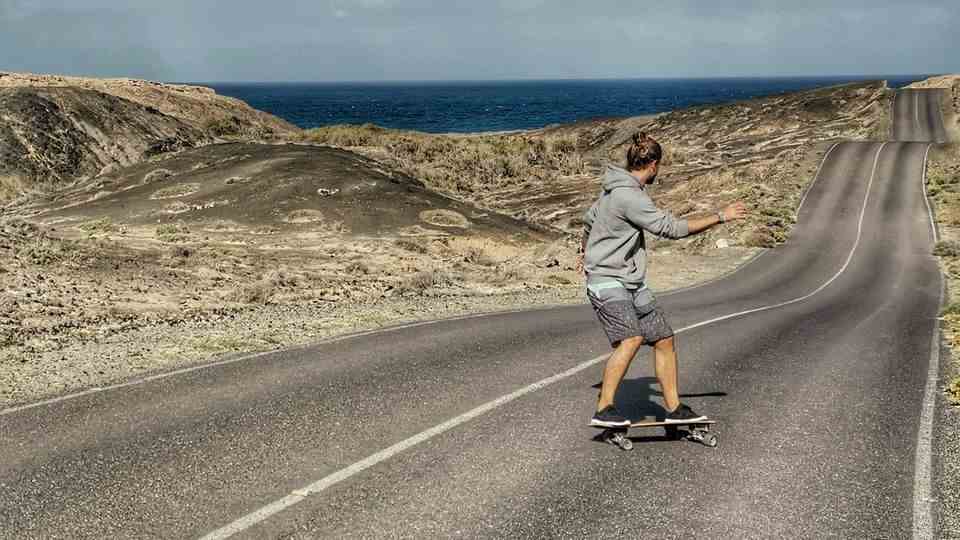 Nick Martin skateboards on a street in Fuerteventura.