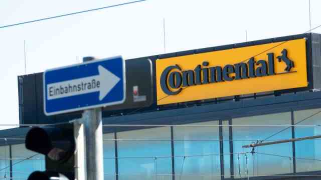 Automotive supplier: The Continental logo hangs on the new headquarters behind a one-way street sign: The numbers are bad.