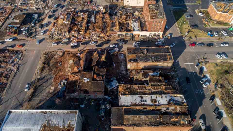 In downtown Mayfield, Kentucky, buildings lie in ruins after a tornado ripped through the area. 