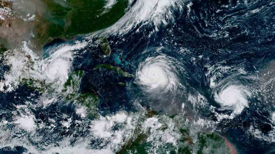 The satellite image shows the center of the hurricane "Irma" north of the island of Hispaniola.  Left is hurricane "Katia" in the Gulf of Mexico and right hurricane "Jose" seen on the Atlantic Ocean.