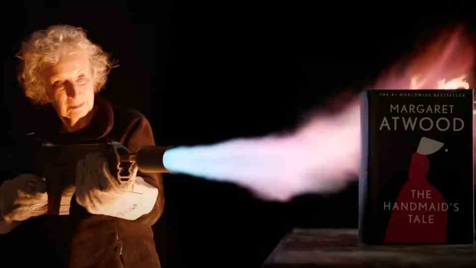 Margaret Atwood uses a flamethrower to attempt a non-flammable version of her book "The Handmaid's Tale" to light