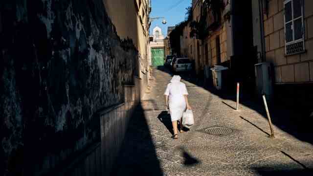 Italy photo book: A nun near the convent of the Suore Figlie della Carità in the Chiaia district.