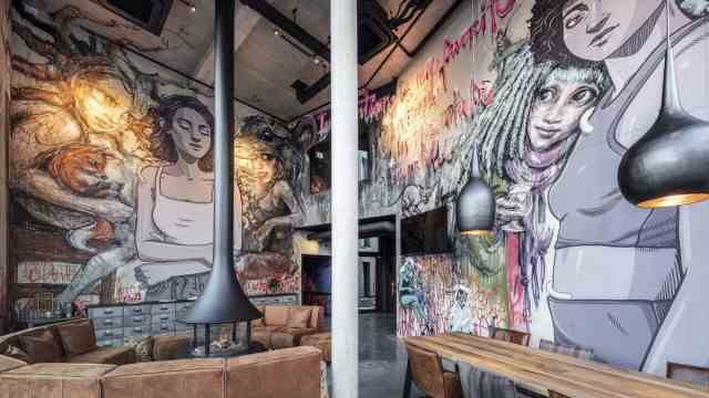 Street Art Hotel: You can have breakfast in the colorful lobby or in the restaurant next door "love beer".