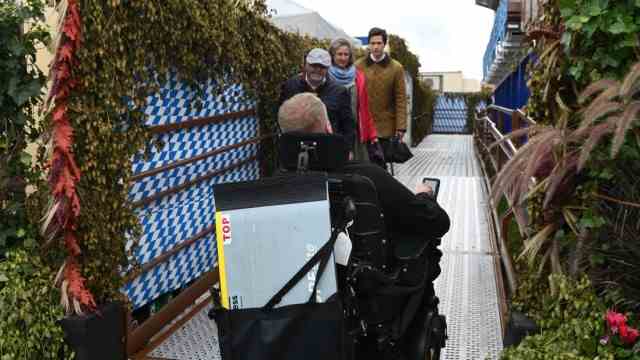 Accessibility test: Markus Dieminger uses a ramp to get to the wheelchair-accessible gondolas.