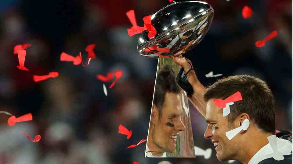 Tampa Bay Buccaneers quarterback Tom Brady with the Lombardi Trophy, the Super Bowl winner's trophy