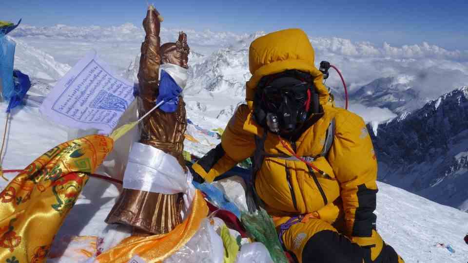"When I'm upstairs, I stay calm." Mountaineer Tsang Yin-Hung, 44, a teacher from Hong Kong, has set a new record on Mount Everest.