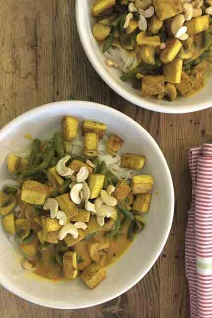 Column: My passion: tofu with mushrooms and beans in a turmeric-ginger sauce, served with rice noodles.