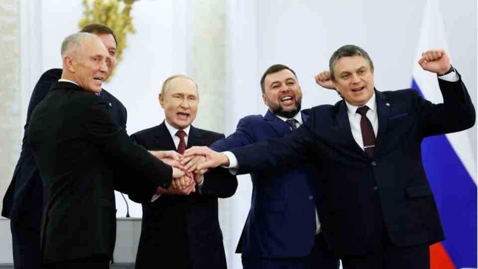 Putin and the representatives of the annexed regions