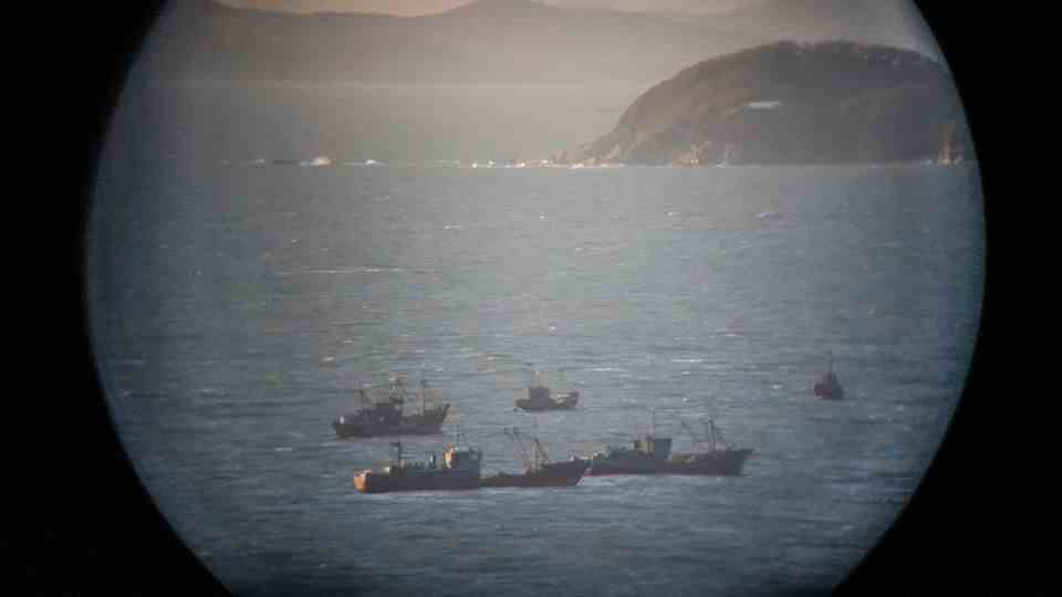North Korea's territory and fishing boats are seen from Yeonpyeong Island Observatory