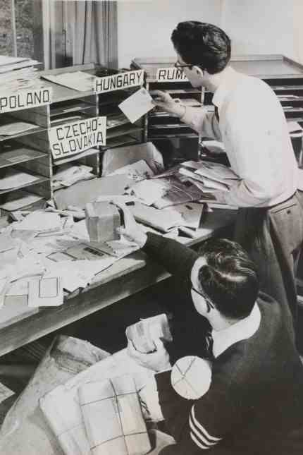 Exhibition: Radio Free Europe employees sorting listener's mail, photograph from 1960.