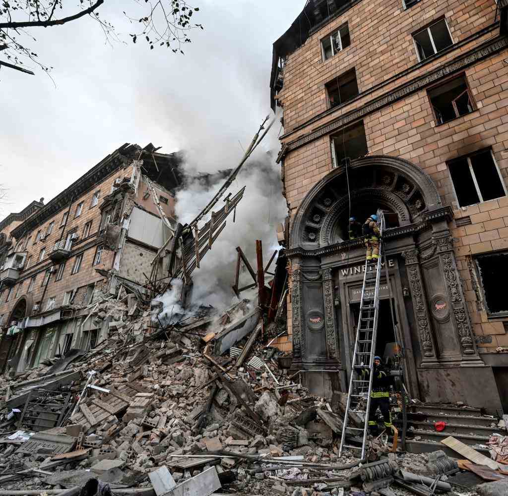 Rescue workers are on duty in a hit building in Zaporizhia on Thursday