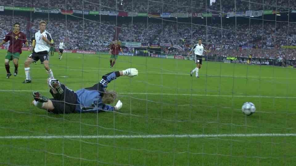 Oliver Kahn tries in vain to get a ball, which follows 0:3 against Portugal